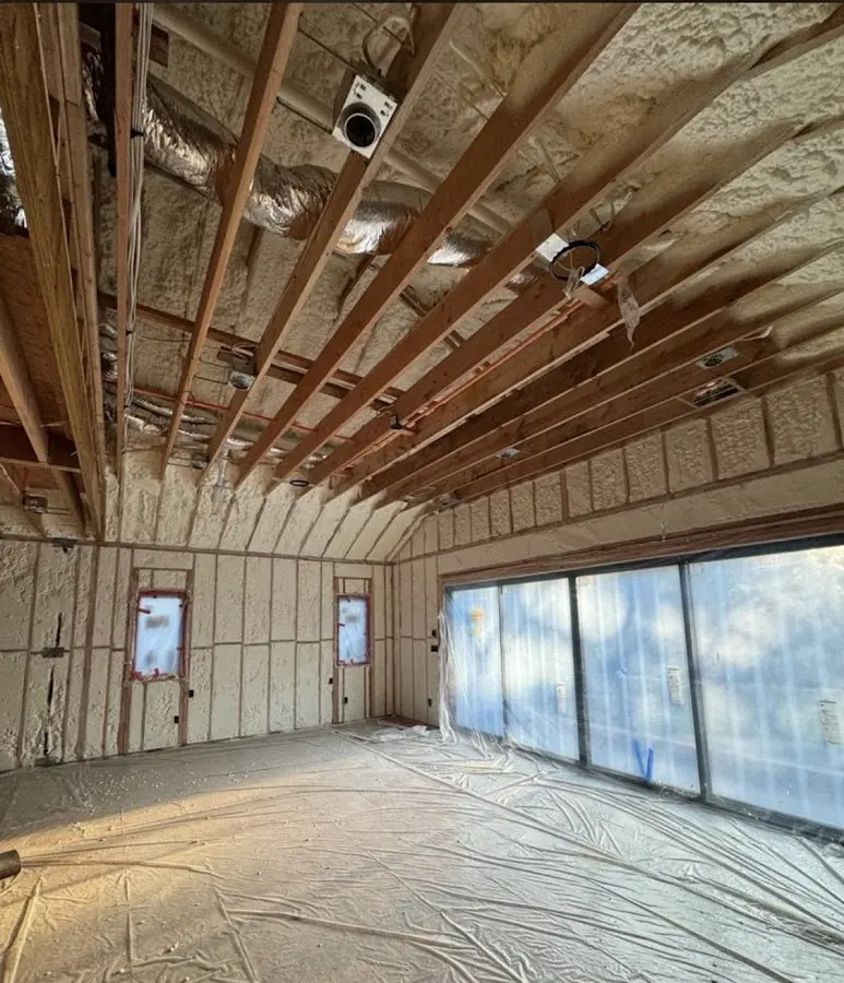 Interior walls and ceiling insulated with spray foam during new construction in North Caldwell